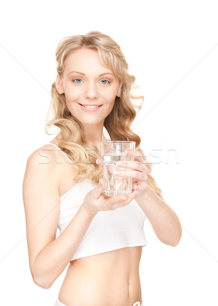 Güzel bir kadın cam su beyaz kadın içmek Stok fotoğraf © dolgachov