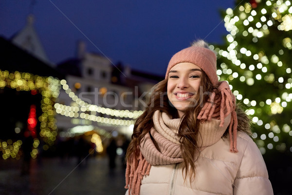 happy young woman at christmas market in winter Stock photo © dolgachov