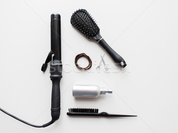 Stock photo: iron, brushes, styling spay, hair ties and pins