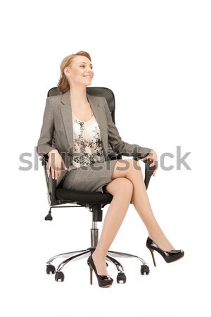 young businesswoman sitting in chair Stock photo © dolgachov