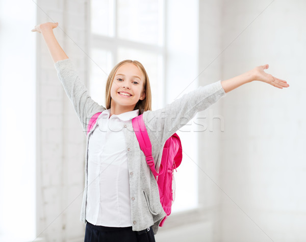 student girl with hands up at school Stock photo © dolgachov
