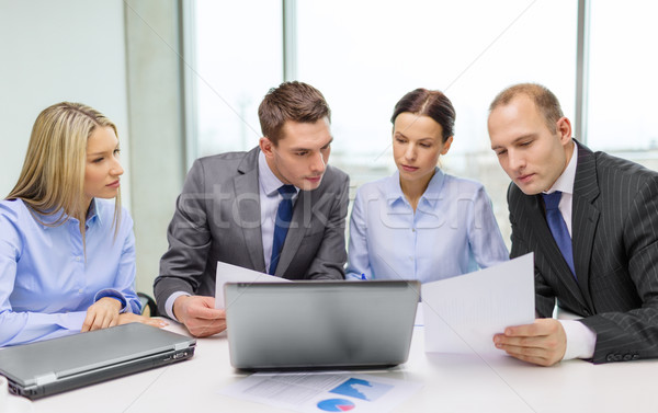 Stock photo: business team with laptop having discussion