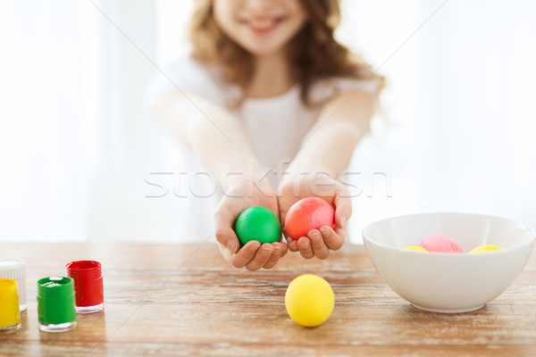 close up of girl holding colored eggs Stock photo © dolgachov