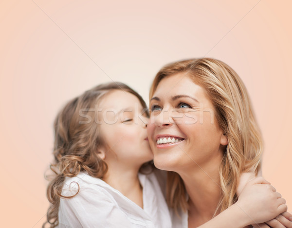 smiling mother and daughter hugging Stock photo © dolgachov
