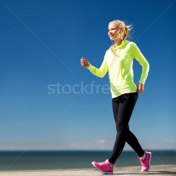 woman walking outdoors Stock photo © dolgachov