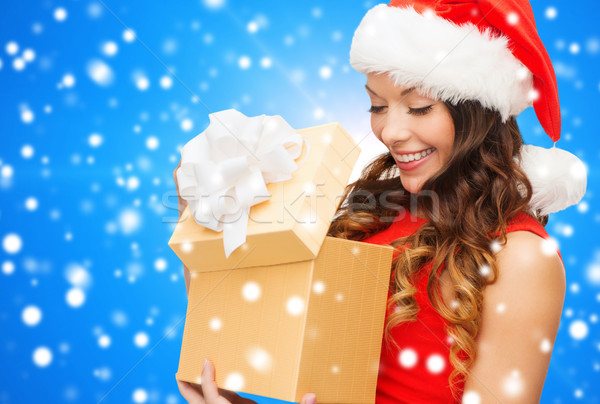smiling woman in red dress with gift box Stock photo © dolgachov