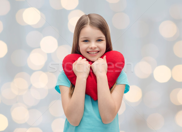 Mosolyog kislány piros szív szeretet jótékonyság Stock fotó © dolgachov