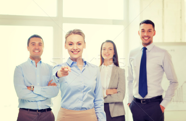 businesswoman in office pointing finger at you Stock photo © dolgachov