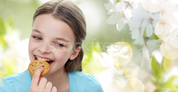 ストックフォト: 笑みを浮かべて · 女の子 · 食べ · クッキー · ビスケット · 人