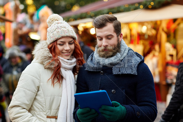happy couple walking with tablet pc in old town Stock photo © dolgachov