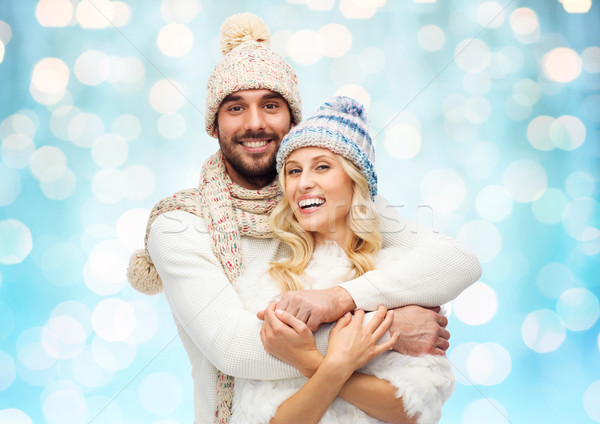 smiling couple in winter clothes hugging Stock photo © dolgachov