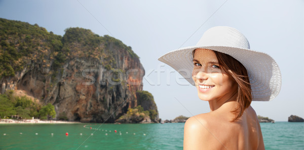 happy young woman in sunhat over summer beach Stock photo © dolgachov