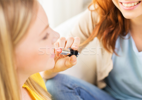 close up of visagist woman applying lipstick Stock photo © dolgachov