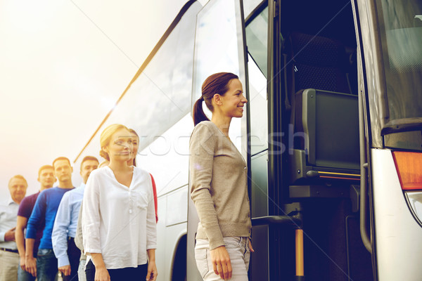 group of happy passengers boarding travel bus Stock photo © dolgachov