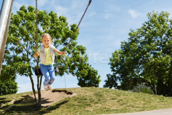 Boldog kislány hinta játszótér nyár gyermekkor Stock fotó © dolgachov