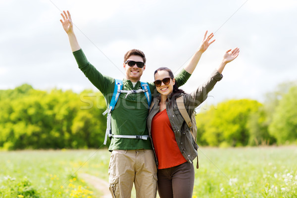 happy couple with backpacks hiking outdoors Stock photo © dolgachov