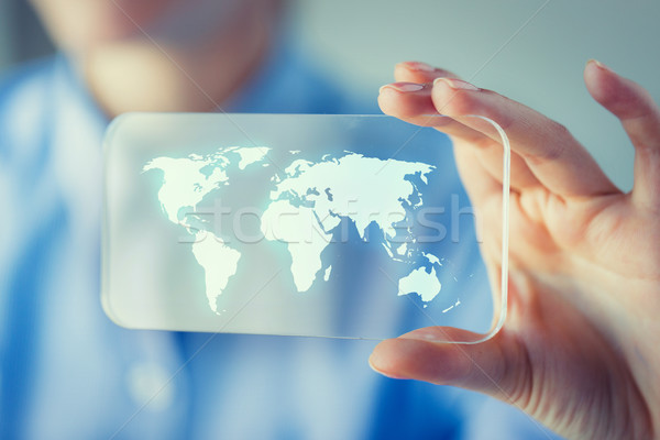 close up of woman with transparent smartphone Stock photo © dolgachov