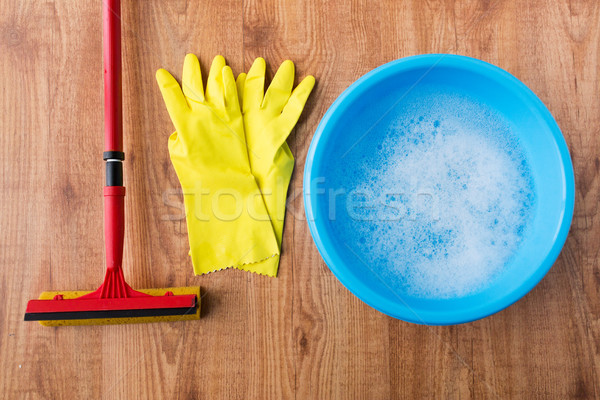 basin with cleaning stuff on wooden background Stock photo © dolgachov