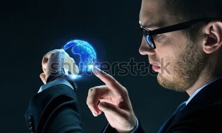 close up of businessman with smart watch Stock photo © dolgachov