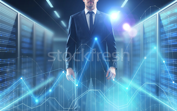 businessman with virtual diagram charts Stock photo © dolgachov