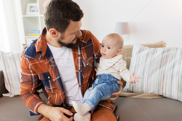 Stock photo: happy father with little baby boy at home