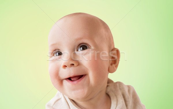 Feliz pequeno bebê menino verde Foto stock © dolgachov