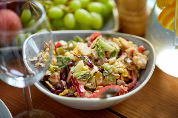 smoked chicken salad in bowl on wooden table Stock photo © dolgachov