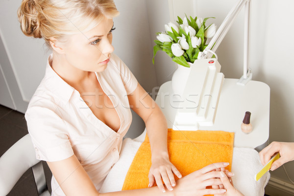 woman having a manicure at the salon Stock photo © dolgachov