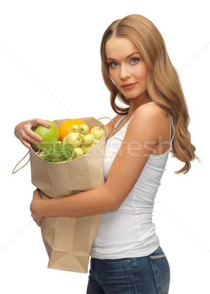 woman with shopping bag full of fruits Stock photo © dolgachov