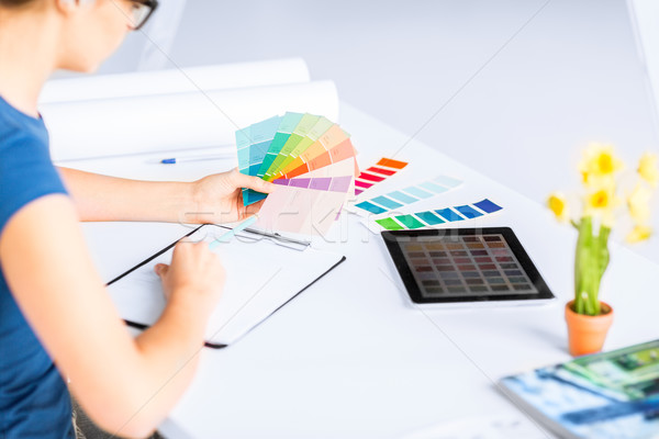 woman working with color samples for selection Stock photo © dolgachov