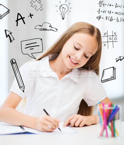 Stock photo: little student girl drawing at school