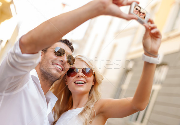 Stock photo: travelling couple taking photo picture with camera