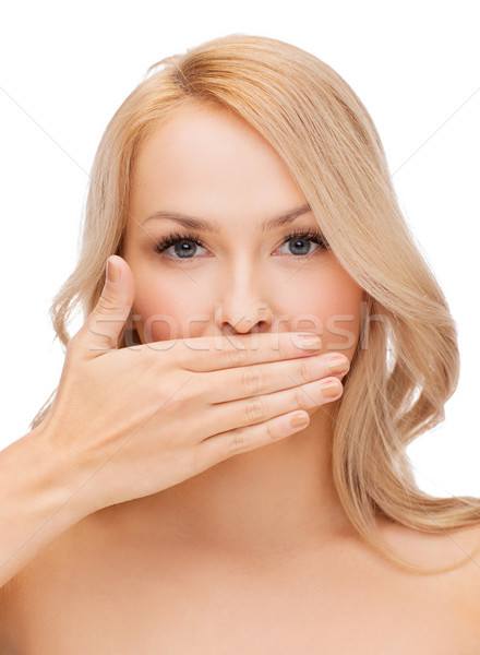 beautiful woman covering her mouth Stock photo © dolgachov