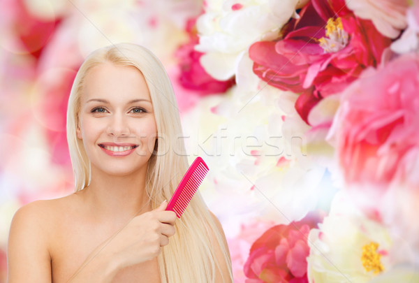 smiling woman with hair brush Stock photo © dolgachov