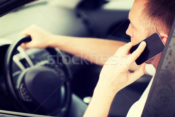 man using phone while driving the car Stock photo © dolgachov