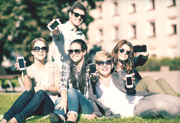 Stock photo: students showing smartphones