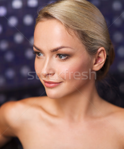 close up of young woman sitting in bath towel Stock photo © dolgachov