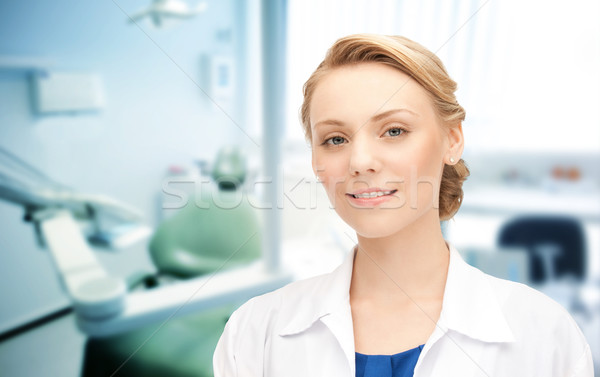 happy young female dentist with tools Stock photo © dolgachov