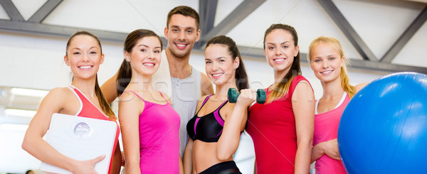 Stock photo: group of smiling people in the gym