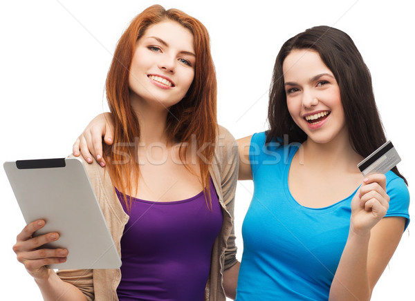 Iki gülen kızlar kredi kartı online alışveriş Stok fotoğraf © dolgachov