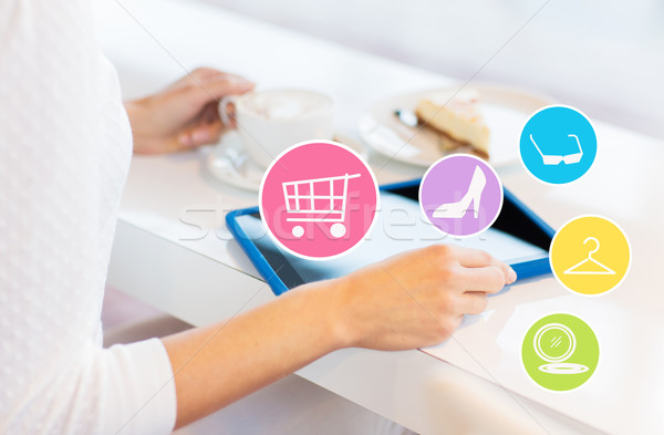 close up of woman with tablet pc drinking coffee Stock photo © dolgachov