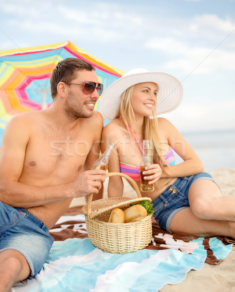 Mutlu çift piknik güneşlenme plaj yaz Stok fotoğraf © dolgachov