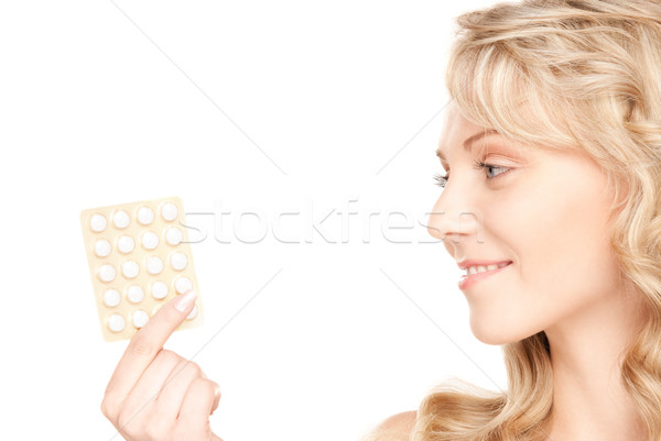 Młoda kobieta pigułki zdjęcie biały kobieta medycznych Zdjęcia stock © dolgachov
