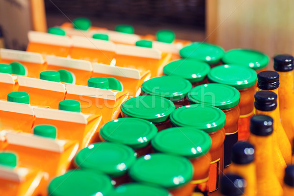 jars and bottles with eco food at bio market Stock photo © dolgachov