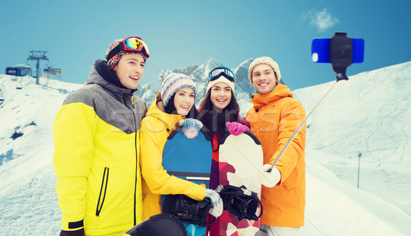 Heureux amis smartphone sports d'hiver loisirs amitié [[stock_photo]] © dolgachov