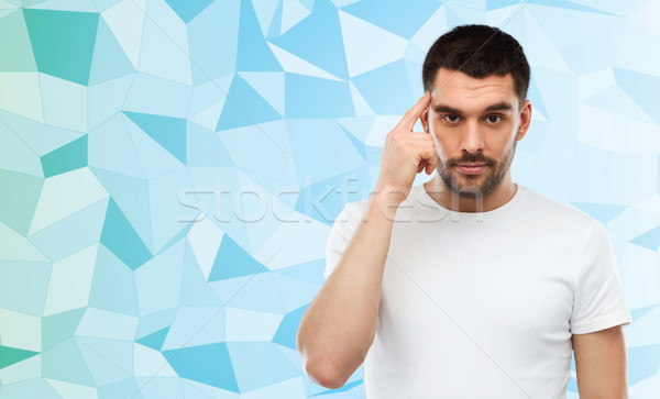 Człowiek palec świątyni niski reklama pomysł Zdjęcia stock © dolgachov