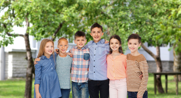 happy smiling children hugging over backyard Stock photo © dolgachov