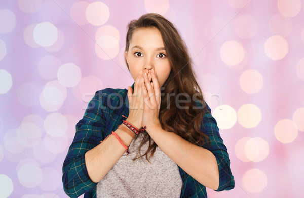 scared teenage girl over pink holidays lights Stock photo © dolgachov