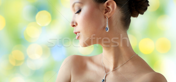 beautiful asian woman with earring and pendant Stock photo © dolgachov