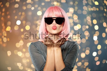 beautiful woman in black hat over night city Stock photo © dolgachov